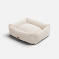 Cama para perros BIMBAS BRAND desenfundable de pana en color beige con diseño rectangular y bordes acolchados