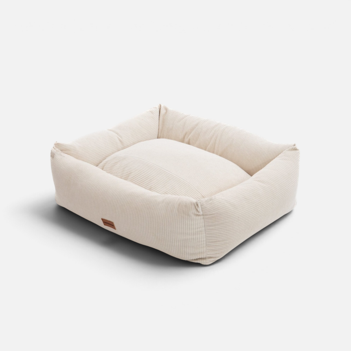 Cama para perros BIMBAS BRAND desenfundable de pana en color beige con diseño rectangular y bordes acolchados