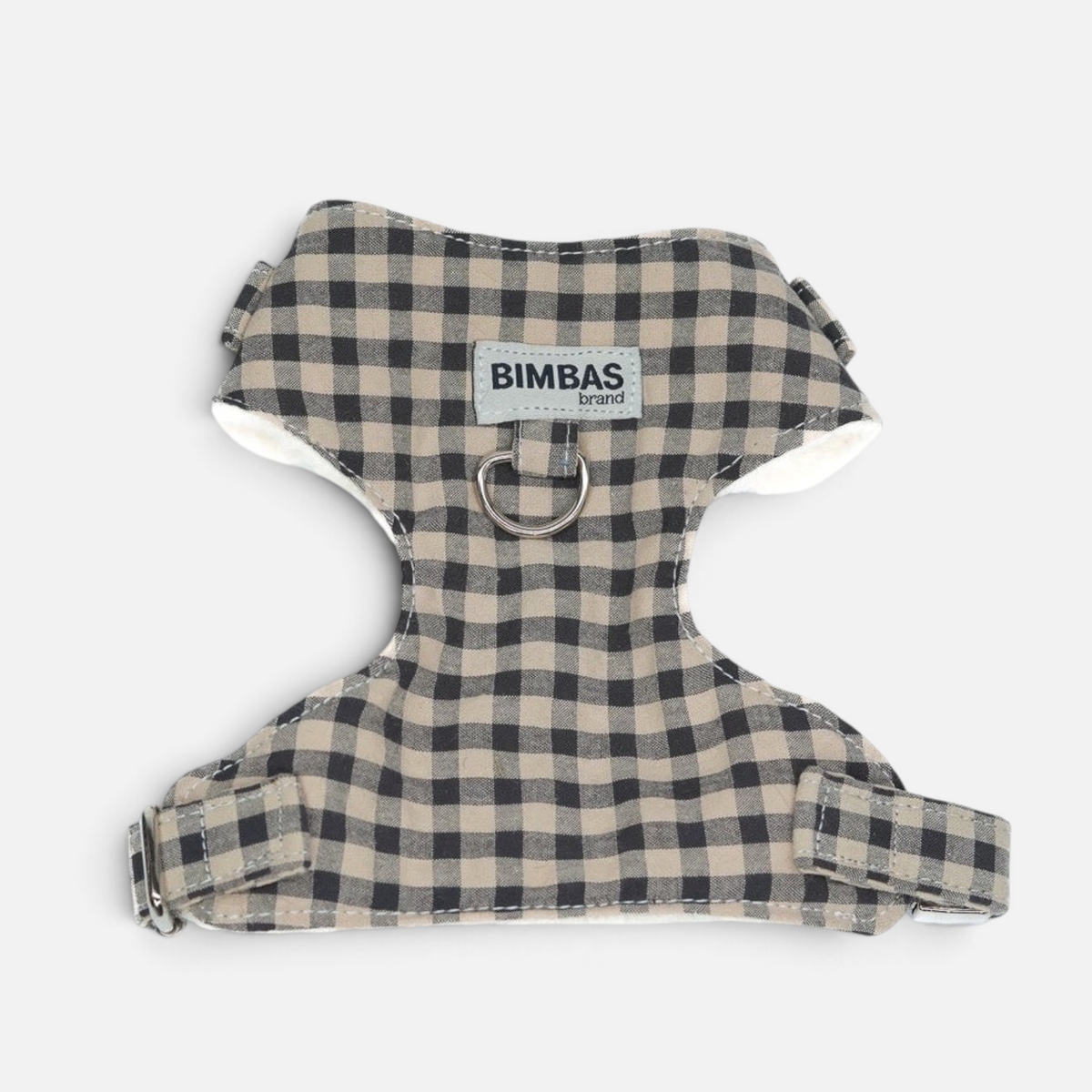 Arnés para perros BIMBAS BRAND con estampado de cuadros vichy beige y negro, forro de borreguito y cierres metálicos.